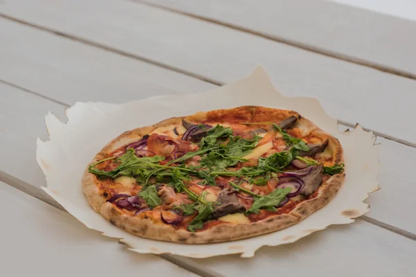 Italian pizza on table — Stock Photo, Image