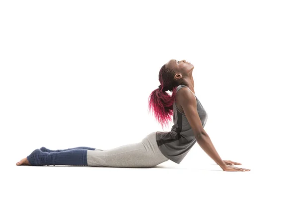 Vrouw in Cobra yoga pose — Stockfoto