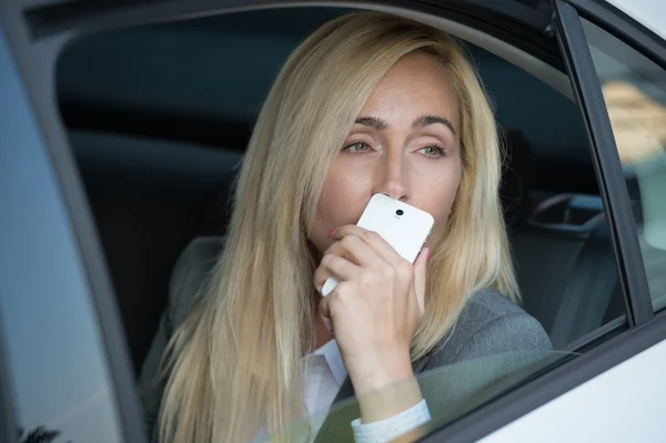 Business woman in car — Stock Photo, Image