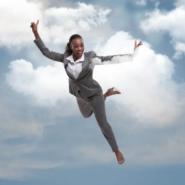 Businesswoman flying in   sky — Stock Photo, Image