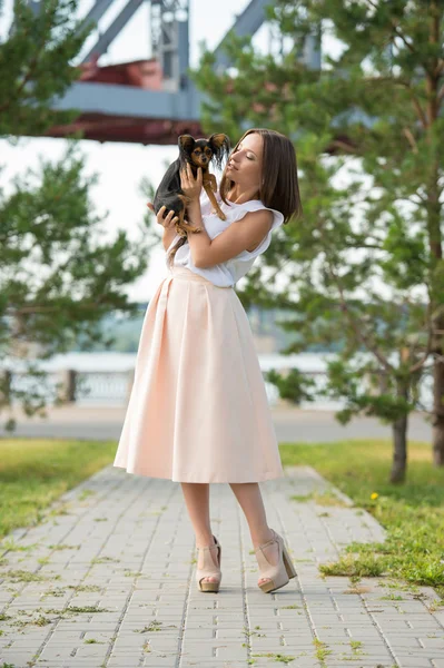 Woman holding small dog — Stock Photo, Image