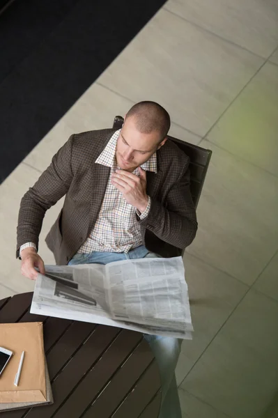 Businessman reading newspaper — Stock Photo, Image