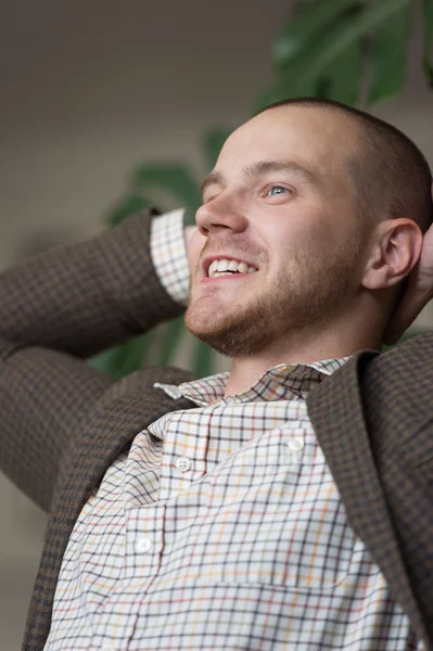 Satisfied businessman relaxing in office — Stock Photo, Image