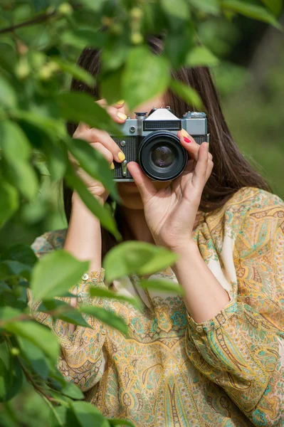 Girl with vintage retro camera — Stock Photo, Image
