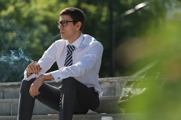 Well dressed businessman smoking — Stock Photo, Image