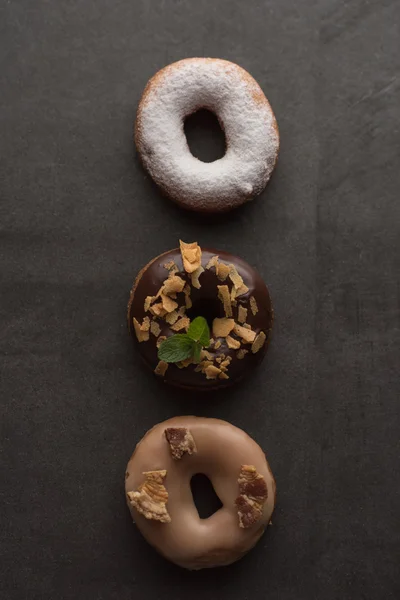 Three donuts with icing — Stock Photo, Image