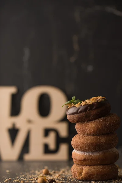 Donuts with nuts and love sign — Stock Photo, Image