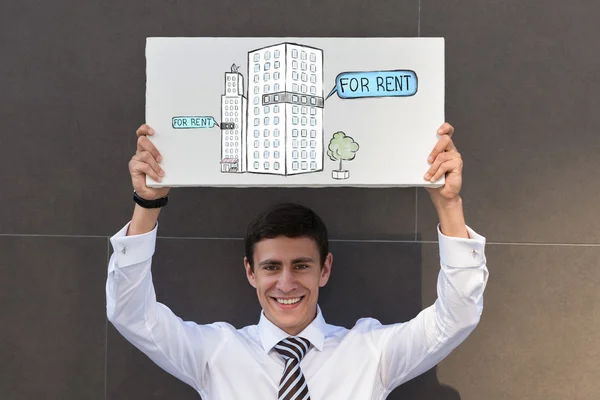 Businessman offering office for rent — Stock Photo, Image