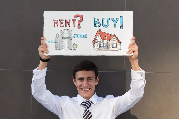 Empresário com sinal de conceito de hipoteca — Fotografia de Stock