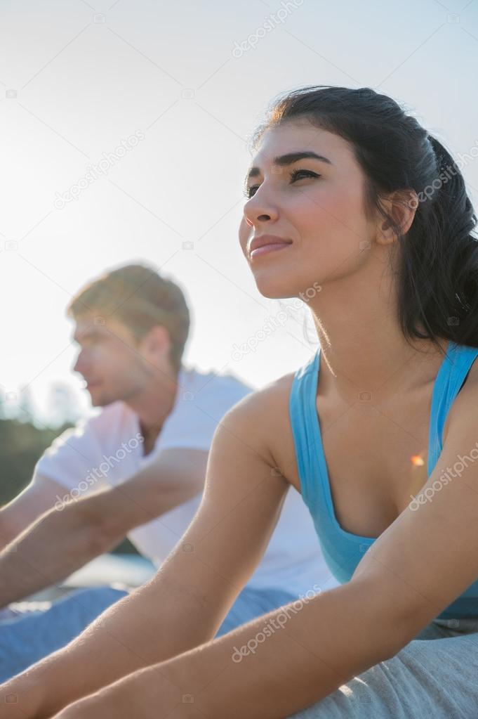 Young couple doing yoga