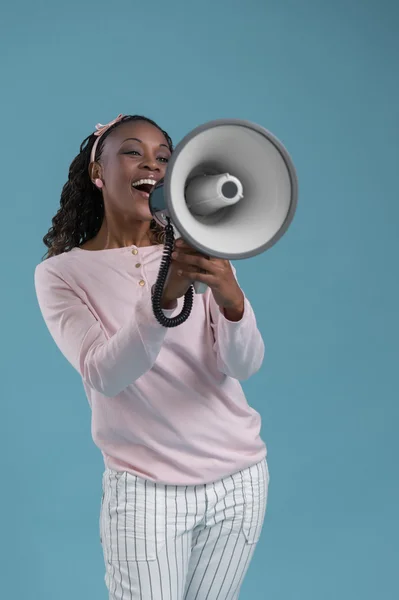 African woman with megaphone — Stock Photo, Image