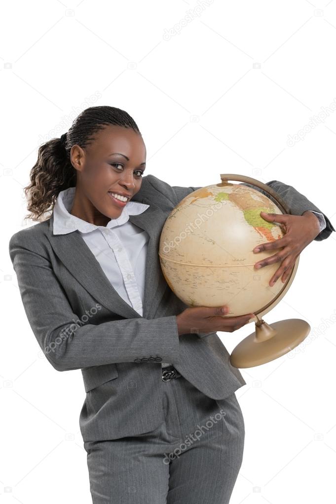 Business woman holding globe