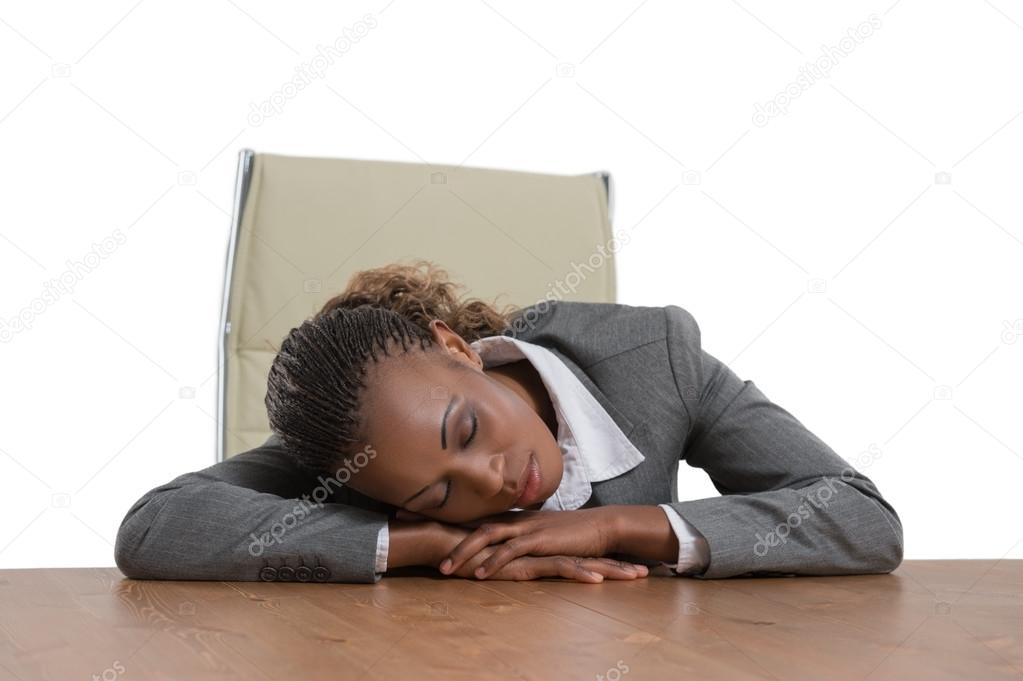 African business woman sitting at desk