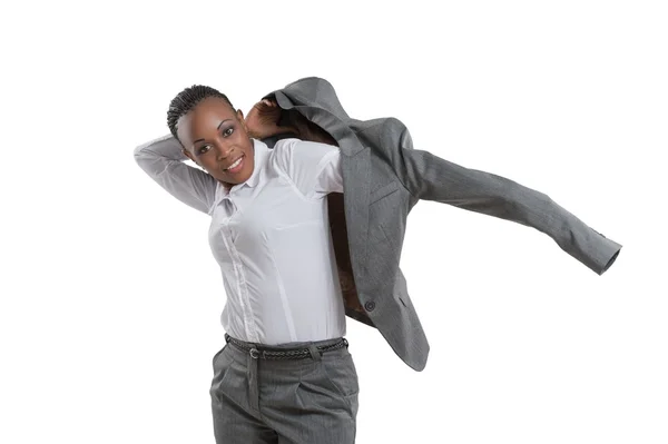 Mujer de negocios poniéndose chaqueta — Foto de Stock