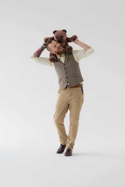 Groom playing with teddy bear — Stock Photo, Image