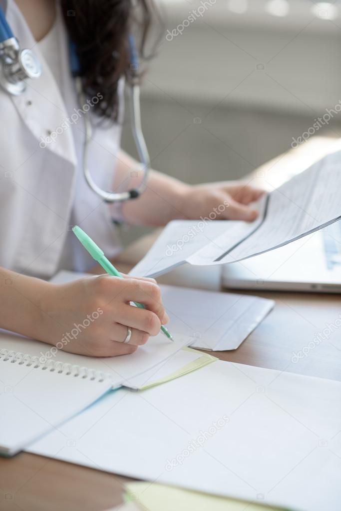 Doctor taking notes