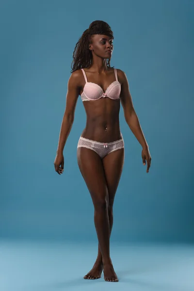 African woman in pink lingerie — Stock Photo, Image