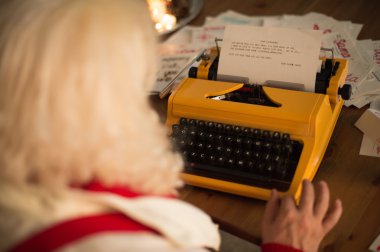 Santa Claus responding to children's letters clipart