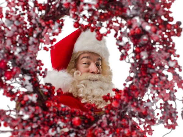 Santa Claus en marco de corona de Navidad — Foto de Stock