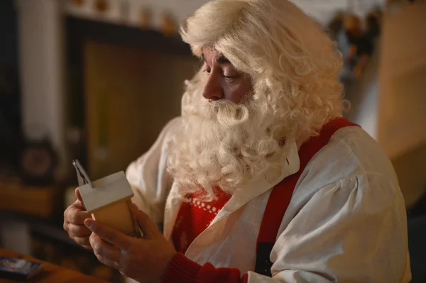 Santa making wooden nesting box — Stock Photo, Image