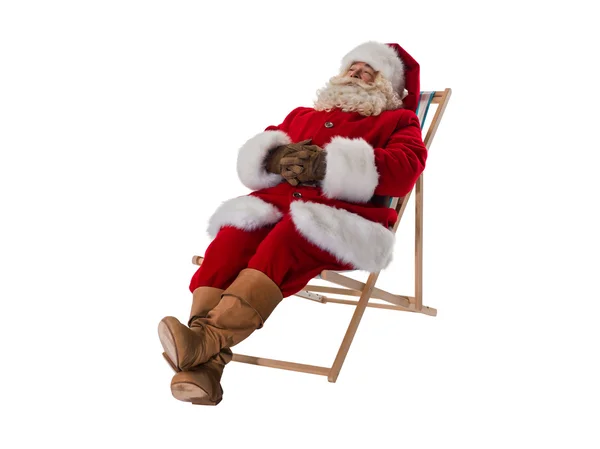 Santa Claus resting on deck chair — Stock Photo, Image