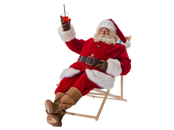 Santa Claus sitting on deck chair — Stock Photo, Image