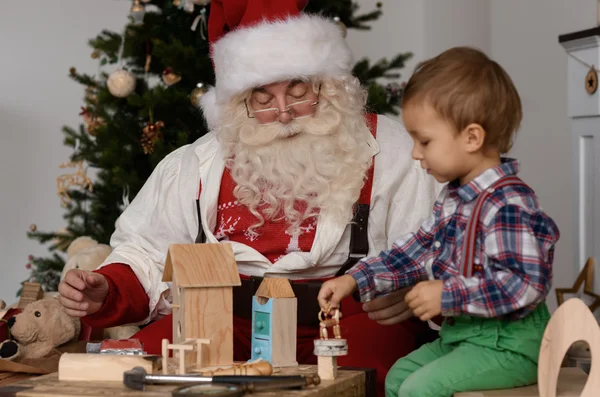 Papai Noel com criança — Fotografia de Stock