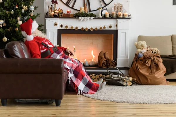 Santa Claus Warming near Fireplace — Stock Photo, Image