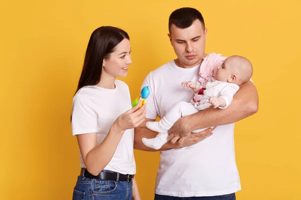 Happy Family Playing Newborn Daughter While Posing Isolated Yellow Background — Stock Photo, Image