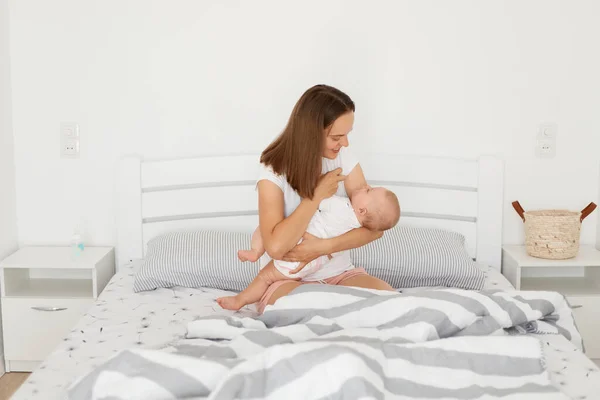 Indoor Shot Smiling Mother Playing Her Baby Girl Woman Wearing — Stock Photo, Image