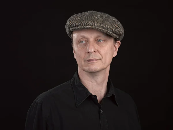 Male model wearing a patterned side hat — Stock Photo, Image