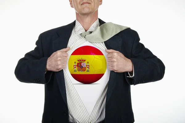 Super-herói puxando camisa aberta com bola de futebol - Espanha — Fotografia de Stock