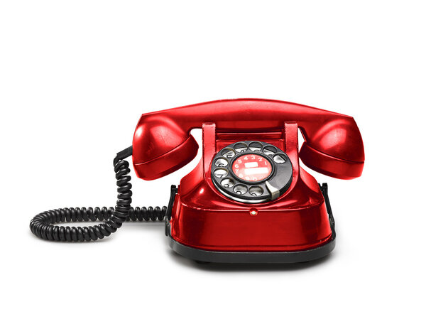 Старый красный телефон с вращающимся номером
