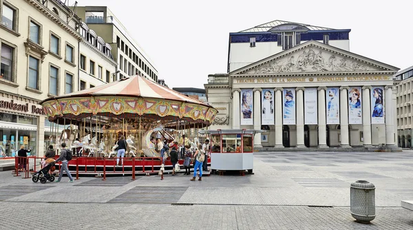 Carousel in front of the Royal Theatre la Monnaie in Brussels — Stock Photo, Image