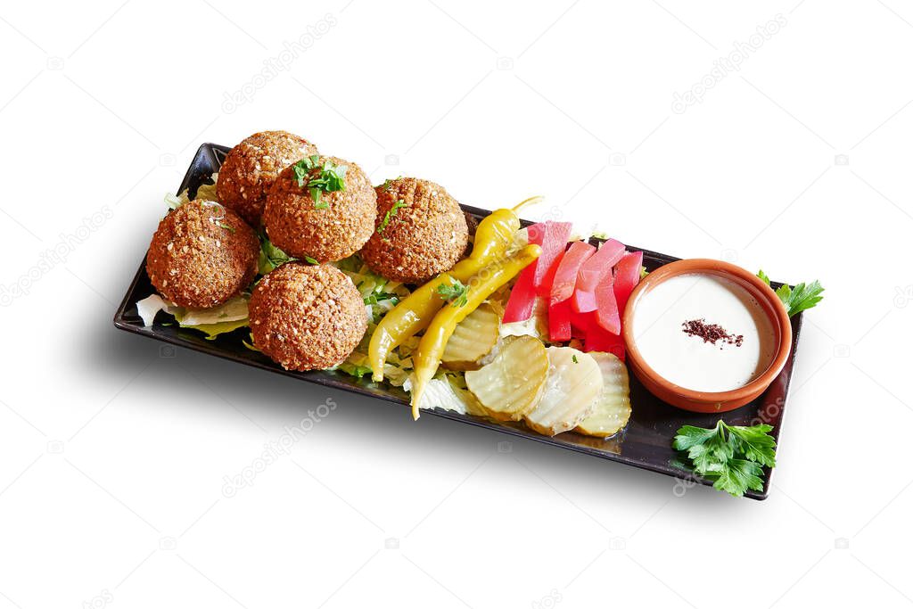 Black plate with Falafel apetizer isolated on white with clipping path