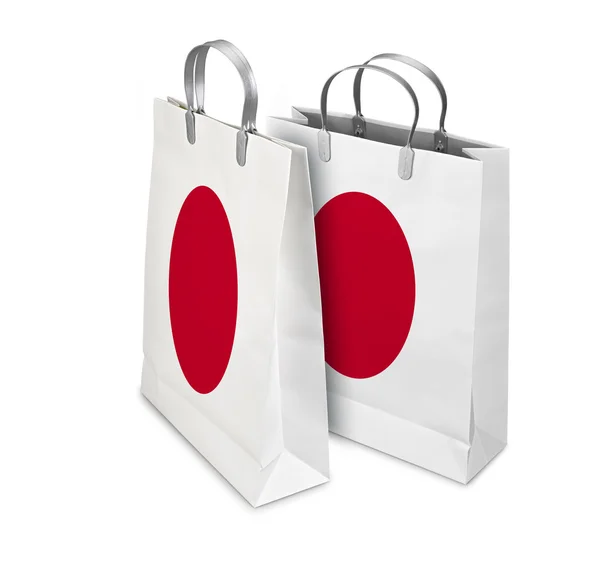 Dois sacos comerciais abertos e fechados com bandeira do Japão. Arbusto de retalho — Fotografia de Stock