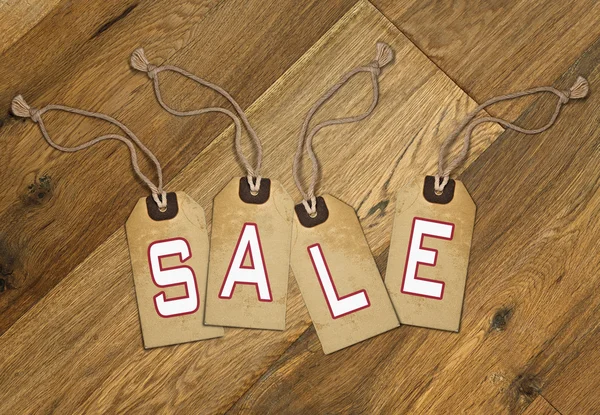Textured tagwith sale tied with brown string — Stock Photo, Image