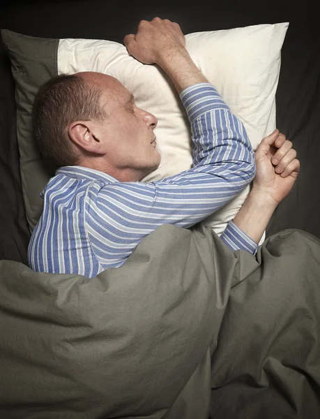 Man sleeping in bed — Stock Photo, Image