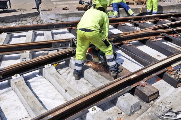 Some workers repair and replace some rail trams — Stock Photo, Image