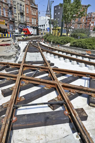 Some workers repair and replace rail trams — Stock Photo, Image