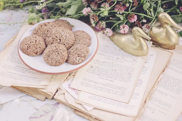 Cookies with old book — Stock Photo, Image