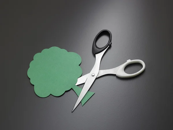 scissors cutting paper tree