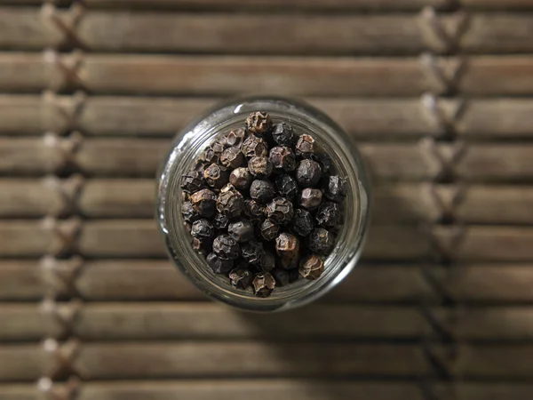 Whole black peppercorns — Stock Photo, Image