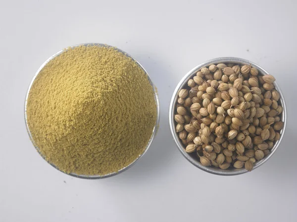 Coriander powder and seeds — Stock Photo, Image