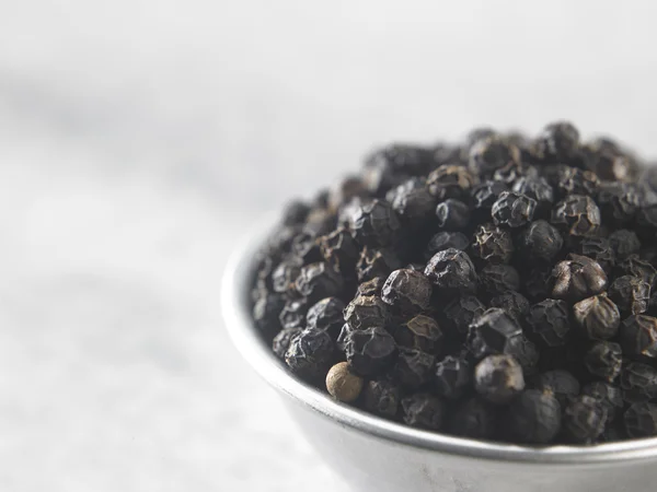 Whole black peppercorns — Stock Photo, Image