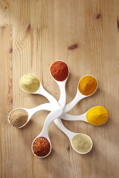 Assorted spices in spoons — Stock Photo, Image