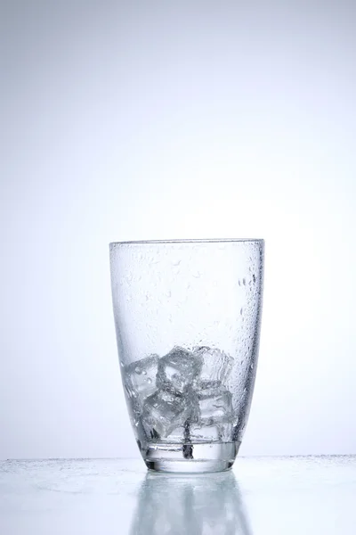 Glass with ice cubes — Stock Photo, Image