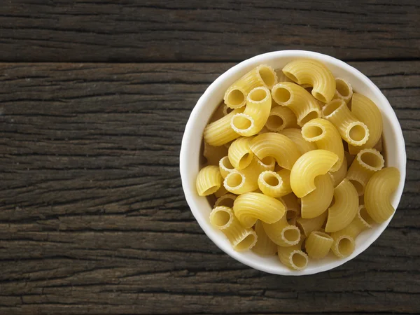 Dry pasta on table — Stock Photo, Image