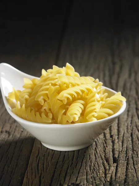 Dry pasta on table — Stock Photo, Image