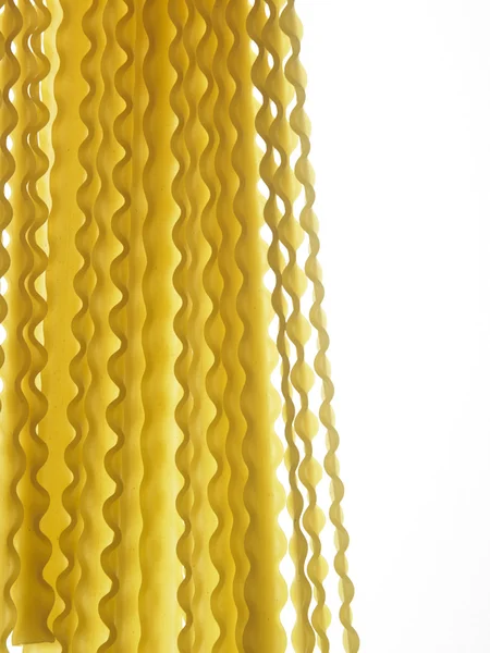 Raw pasta on white — Stock Photo, Image